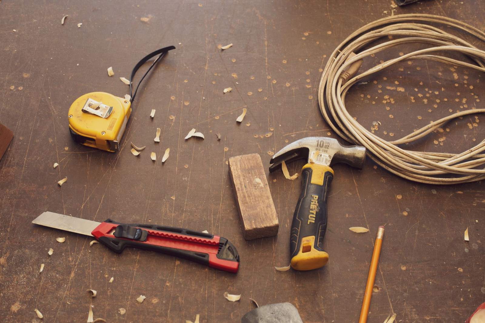 Hand tools laid out on a workbench